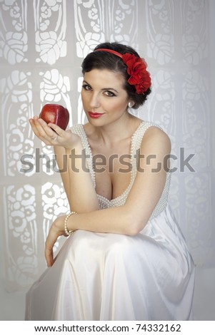 Portrait of young beauty lady in white elegant dress looking like a Snow White princess