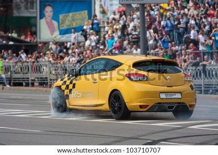 UKRAINE,KIEV - MAY 19: unknown driver drive the Renault Clio, Red Bull Racing Drift Team, Champions Parade, May 19, 2012 in Kiev, Ukraine