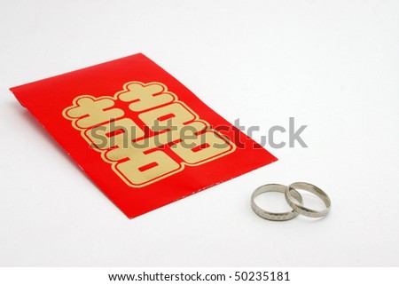 Chinese double happiness packet and Platinum marriage ring.