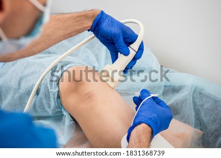 Cardiologist use tubes and ultrasound for radiofrequency catheter ablation. Сток-фото © 