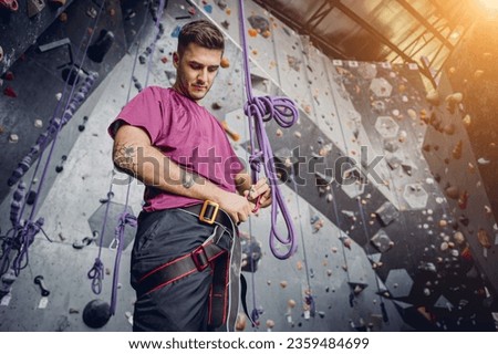 Similar – Image, Stock Photo Woman rock climbing indoors.