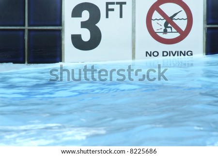 3 Feet and No Diving Signs on Side of Pool