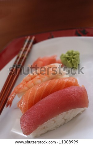 Sushi pieces with chop sticks