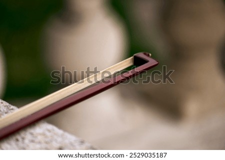 Image, Stock Photo Violin and bow in the hand of the musician in an empty room. Ban on performing in the Corona Crisis