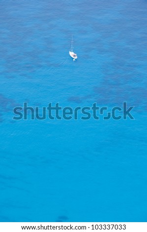 lonely boat in the open sea from above