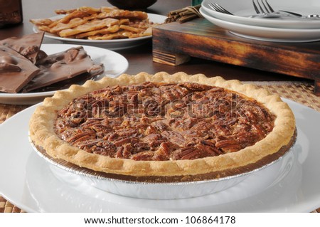 A pecan pie with chocolate bark and peanut brittle