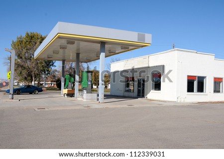 A shut down gas station in a rural town