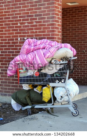 A Shopping Cart Filled With A Homeless Persons Belongings Stock Photo ...