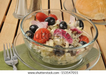 Coleslaw with Greek olives, tomato and feta cheese
