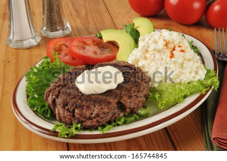 A grilled sirloin patty with cottage cheese