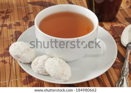 A cup of tea with Russian teacake cookies