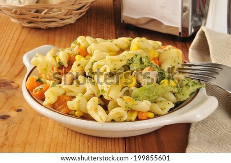 Pasta salad with chicken, carrots, broccoli, and corn