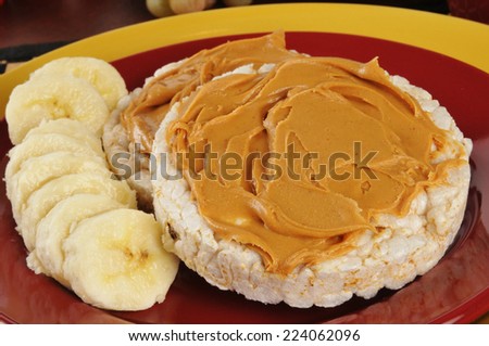 a peanut butter and banana sandwich on healthy rice cakes