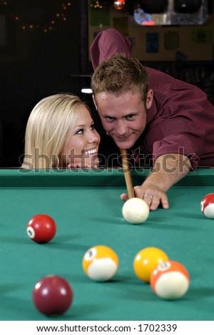 Cute girl distracting a pool player