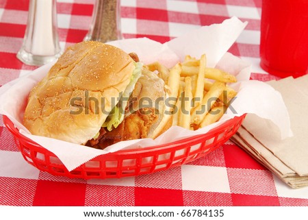 A chicken sandwich in a basket
