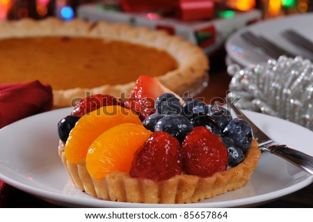 A fruit tart on a christmas dessert table