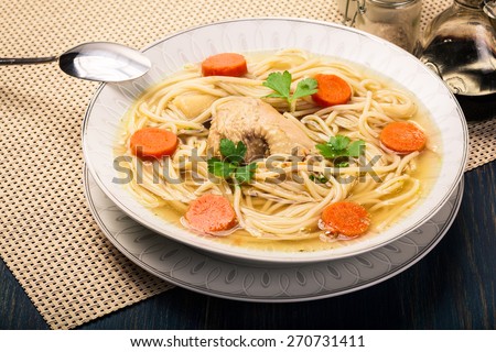 Fresh chicken broth with noodles and carrot