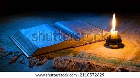 Grunge age dirty rough rustic brown psalm pray torah law letter archiv stack dark black wooden desk table space. New jew culture god Jesus Christ gospel literary art wood still life flame fire concept Сток-фото © 