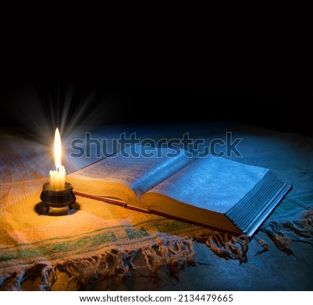 Grunge age dirty rough rustic brown psalm pray torah law letter archiv stack dark black wooden desk table space. New jew culture god Jesus Christ gospel literary art wood still life flame fire concept Сток-фото © 