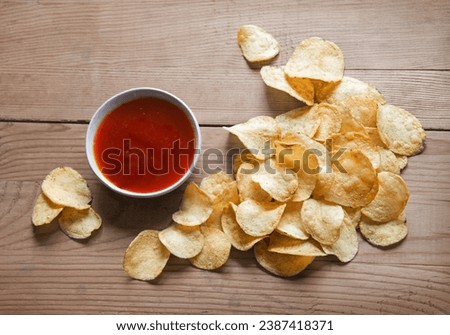 Similar – Image, Stock Photo Potato chips and sauce on the table, close up