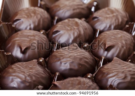 box of sweet marshmallow in chocolate, closeup