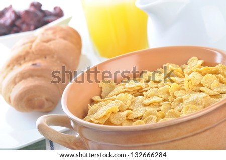 A bowl of corn flakes and milk. Breakfast.