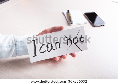 A man holding a sign with the text, for motivation.