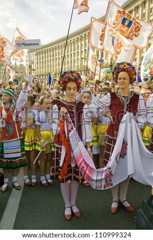 KIEV, UKRAINE - AUGUST 24: The unidentified young women with embroidered towel at the Ukrainian Vyshyvanka Parade 2012 on Khreshchatyk street at Independence Day on August 24, 2012 in Kiev, Ukraine.