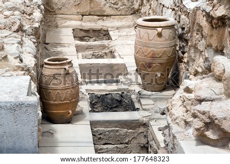 KNOSSOS, CRETE - JULY 23: Giant clay jars from the Palace of Knossos on July 23, 2012. Knossos is the largest Bronze Age archaeological site on Crete.