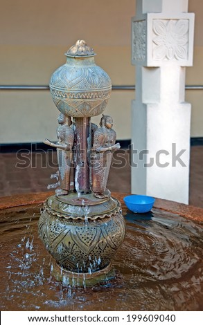 KANDY, SRI LANKA - MARCH 24: The fountain in the inner yard of famous Buddhist Temple of the Tooth Relic (Sri Dalada Maligawa) on March 24, 2014 in Kandy, Sri Lanka.