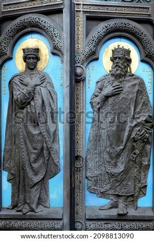 Relief of Olga and Volodymyr on the St Volodymyr's Cathedral gates in Kyiv Ukraine. Text means Olga of Kiev per left and St Prince Volodymyr per right Stok fotoğraf © 