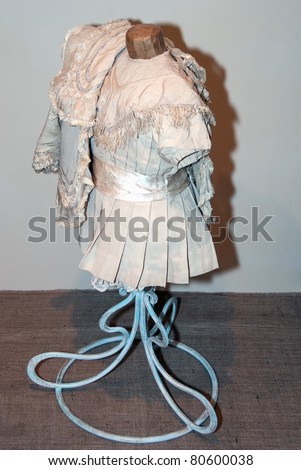 KIEV, UKRAINE - APRIL 16: An original girl\'s dress with tippet is on display at the museum exhibit of Marina Ivanova\'s private collection of antique woman\'s clothes on April 16, 2011 in Kiev, Ukraine.