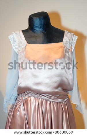 KIEV, UKRAINE - APRIL 16: A fragment of a pink woman\'s dress is on display at the museum exhibit of Marina Ivanova\'s private collection of antique woman\'s clothes on April 16, 2011 in Kiev, Ukraine.