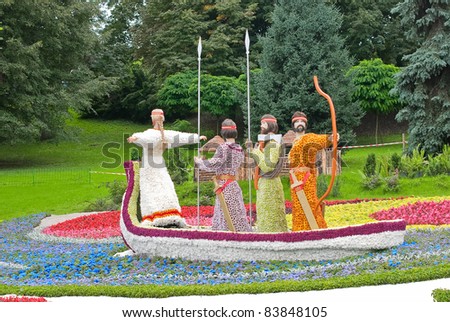 KIEV, UKRAINE - AUGUST 21: Back view to the Kiev emblem made of flowers at the 56th annual flower exhibition on August 21, 2011 in Kiev, Ukraine.