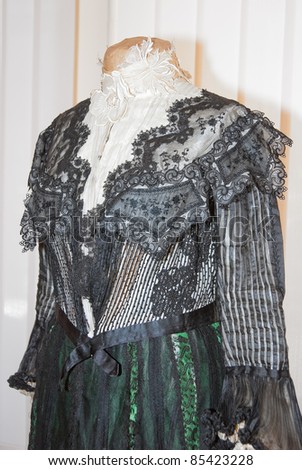 KIEV, UKRAINE - APRIL 16: An original woman\'s lacy black dress is on display at the museum exhibit of Marina Ivanova\'s private collection of antique woman\'s clothes on April 16, 2011 in Kiev, Ukraine.