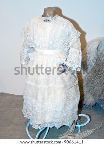 KIEV, UKRAINE - APRIL 16: An original 19th century, white lacy girl\'s dress is on display at the Marina Ivanova\'s private collection exhibit on April 16, 2011 in Kiev, Ukraine.