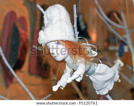 KIEV, UKRAINE - JANUARY 09: A collectible Christmas-tree decoration, which resembles a white angel, is on display at the Angel Age exhibit of Author\'s Dolls on January 09, 2012 in Kiev, Ukraine