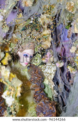 KIEV, UKRAINE - FEBRUARY 26: A collectible doll, which resembles a fantastic lady bird closeup, is on display at the Fashion Doll International exhibit on February 26, 2012 in Kiev, Ukraine.