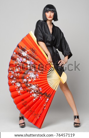 beautiful girl with japanese red fan