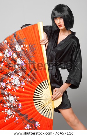 beautiful girl with japanese red fan