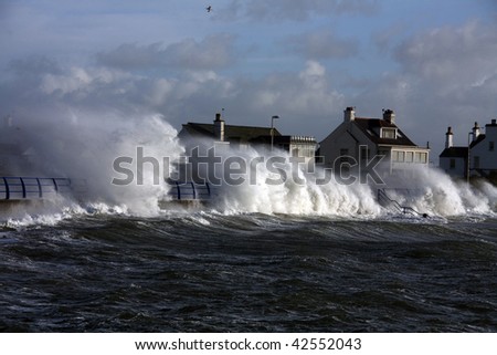 large waves hitting Trearddur bay Breakwater at high tide Isle of Anglesey North Wales