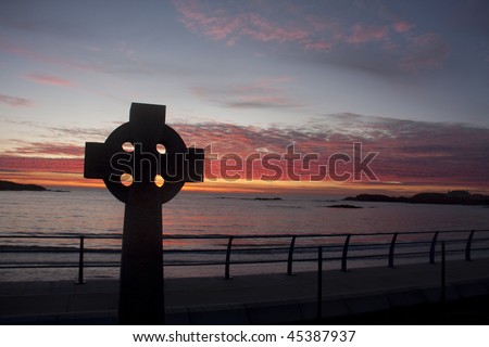Celtic cross at sunset at Trearddur Bay on the Isle of Anglesey