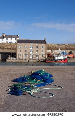 Views of Burghead harbour with the fishing fleet in port Scotland UK