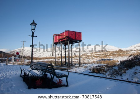 winter in Snowdonia with snow on the ground at Rhyd Ddu steam train station north wales