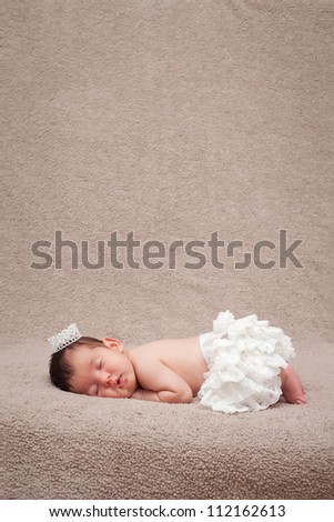 Newborn baby princess. Sleeping small princess.Shallow DoF.