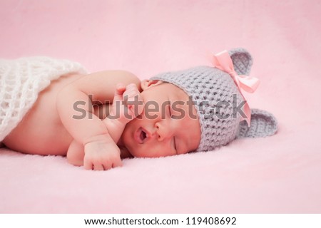 Newborn baby girl right after delivery.Sweet baby girl portrait. Use the photo to represent life, parenting or childhood. Shallow focus.