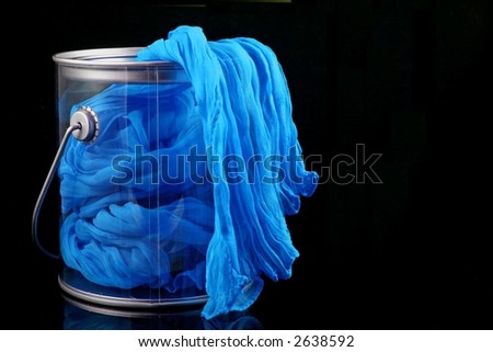 Blue Fabric Flowing Over Edge of Paint Can
