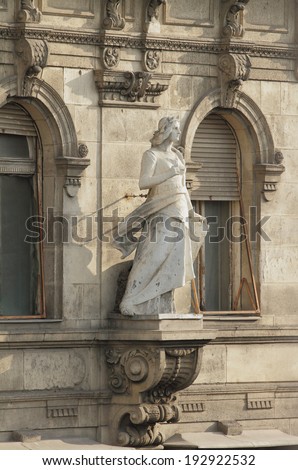 Sculpture of woman on building facade. Budapest, Hungary