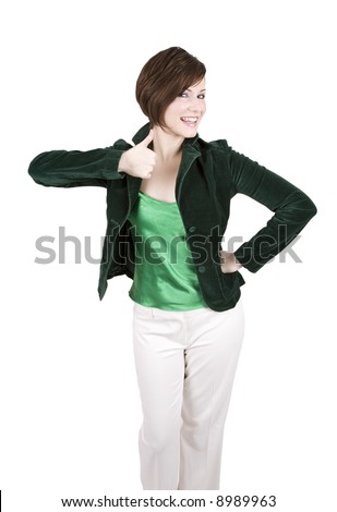 Beautiful brunette woman in a green outfit smiling and giving a thumbs up signal. Isolated on white.