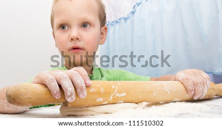 boy rolls the dough